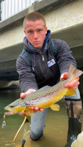 schuylkill_fishing of Instagram holds a wild male brown trout with beautiful colors.