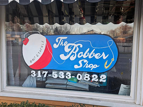 A photograph of The Bobber Shop's storefront.