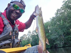 Yak Nastiii of YouTube holds a 24" pickerel caught with Top Strike Fishing spinners.