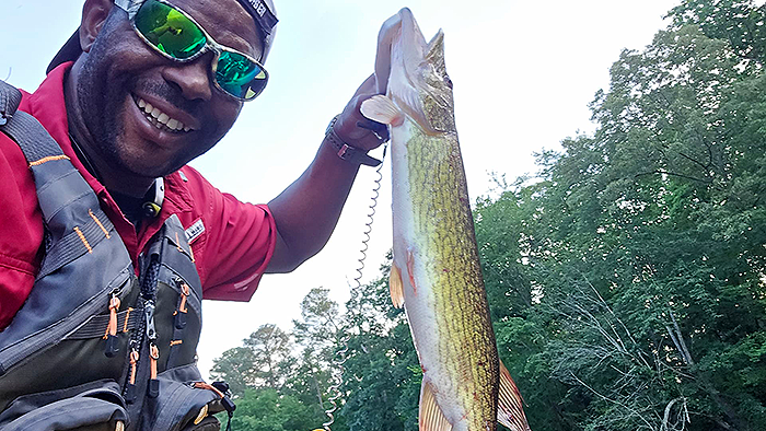 Yak Nastiii of YouTube holds a 24" pickerel caught with Top Strike Fishing spinners.